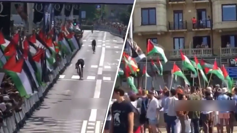 Spectators welcome Israeli cyclists with Palestinian flags during Spain race