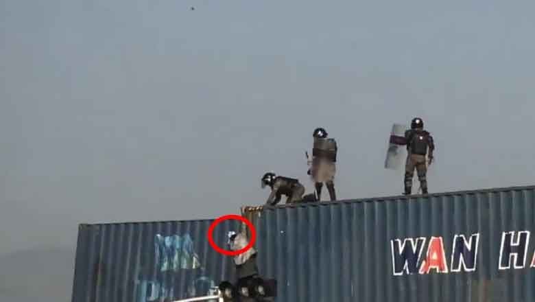 Security personnel push PTI worker off container while he was praying